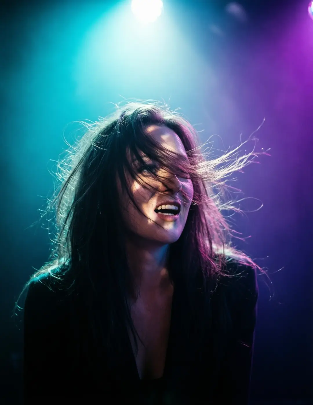 A dynamic portrait photo of a woman, unusual lighting, creative composition, cyan and purple uplighting