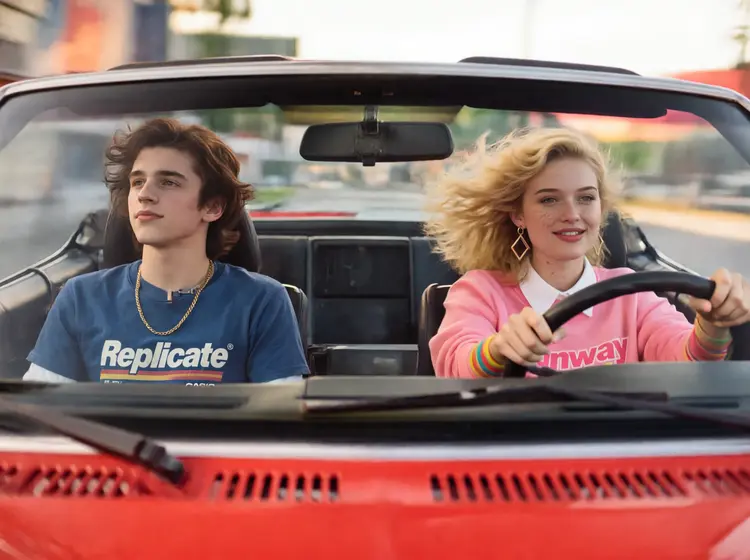 a close up portrait of @woman and @man driving fast in a red 1980s sports car